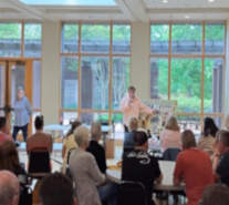 gives presentation to the crowd from England